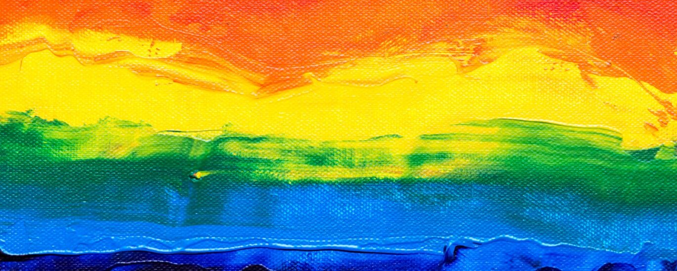 orange yellow green and blue abstract painting