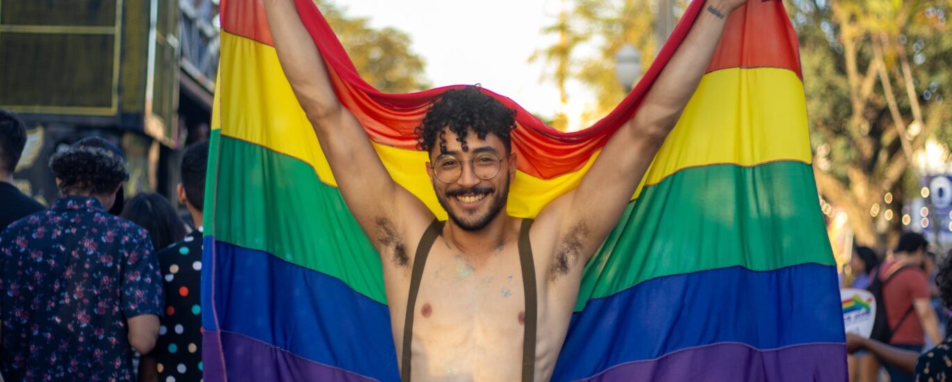 happy man with lgbt flag