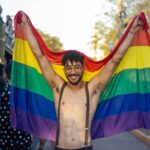 happy man with lgbt flag